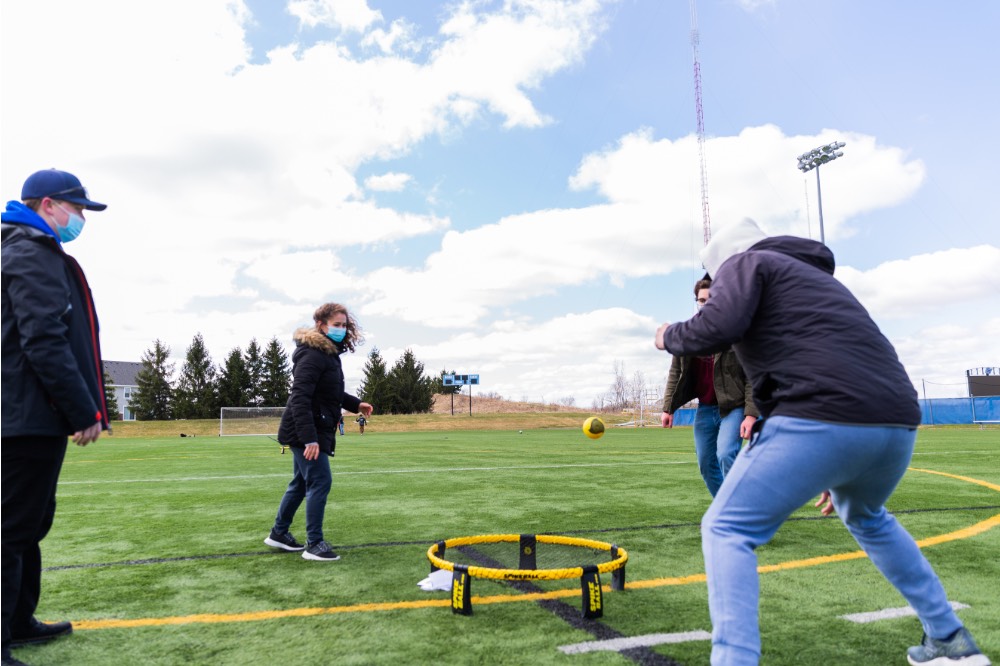 April Field Day 2021: hitting ball in Spikeball